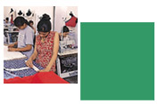 Designer working with fabrics and modern machines in practical sessions